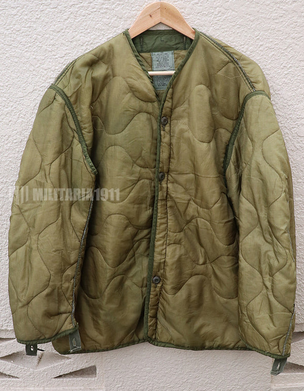 U.S. Army M65 Field Jacket Liner, 1988, partially damaged.