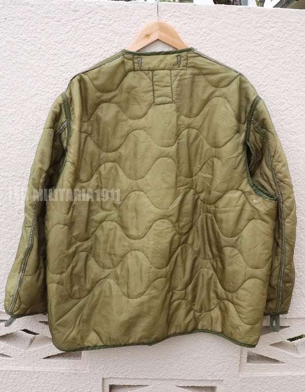 U.S. Army M65 Field Jacket Liner, 1988, partially damaged.