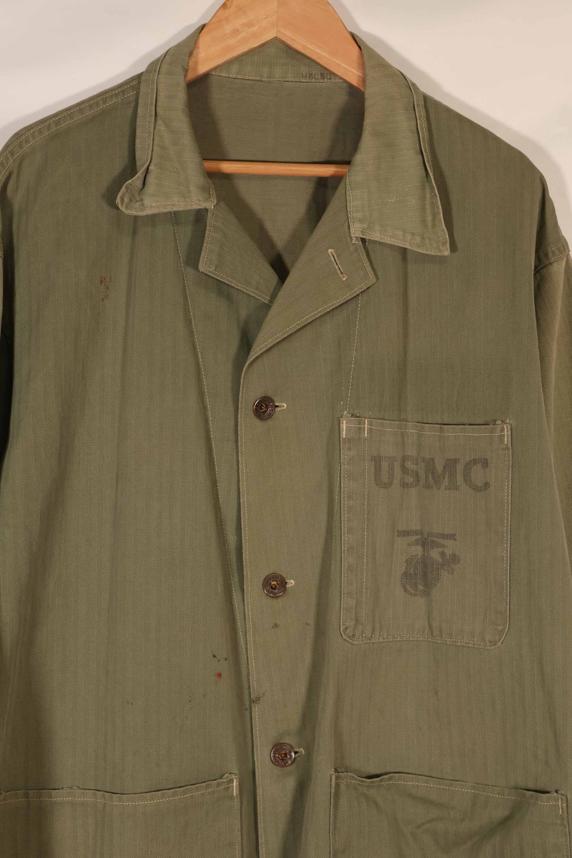 Real 1940s U.S. Marine Corps USMC M41 HBT utility jacket, faded, stained.