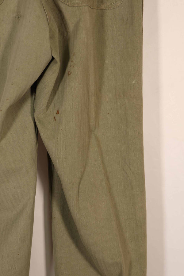 Real 1940s U.S. Marine Corps USMC M42 HBT utility pants, faded, stained.