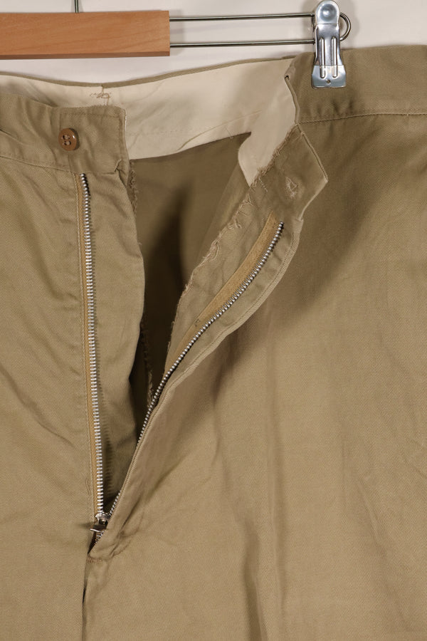 1960s, estimated 34-36 US Army cotton khaki pants, used.