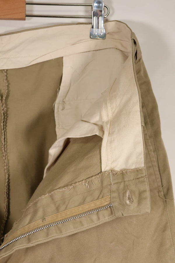 1960s, estimated 34-36 US Army cotton khaki pants, used.