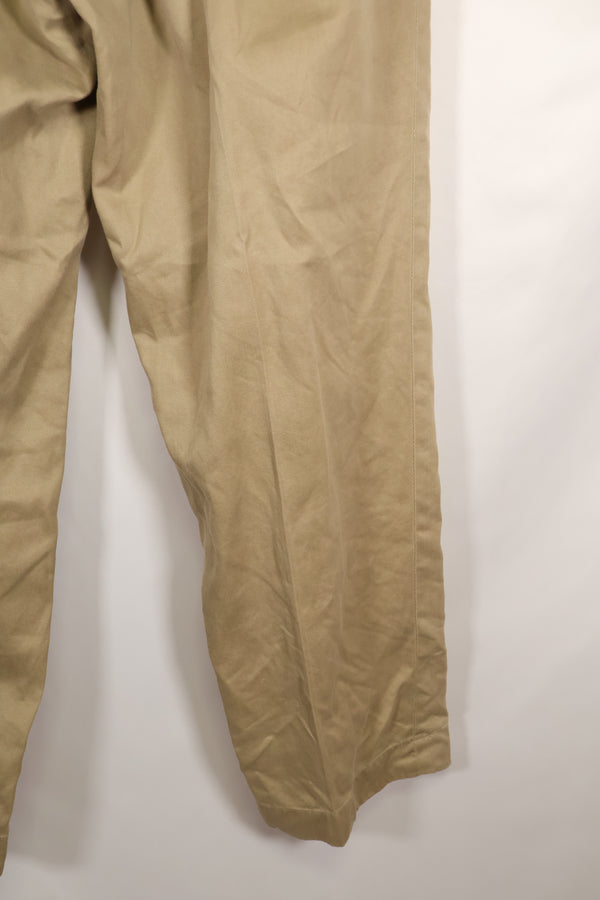 1960s, estimated 34-36 US Army cotton khaki pants, used.
