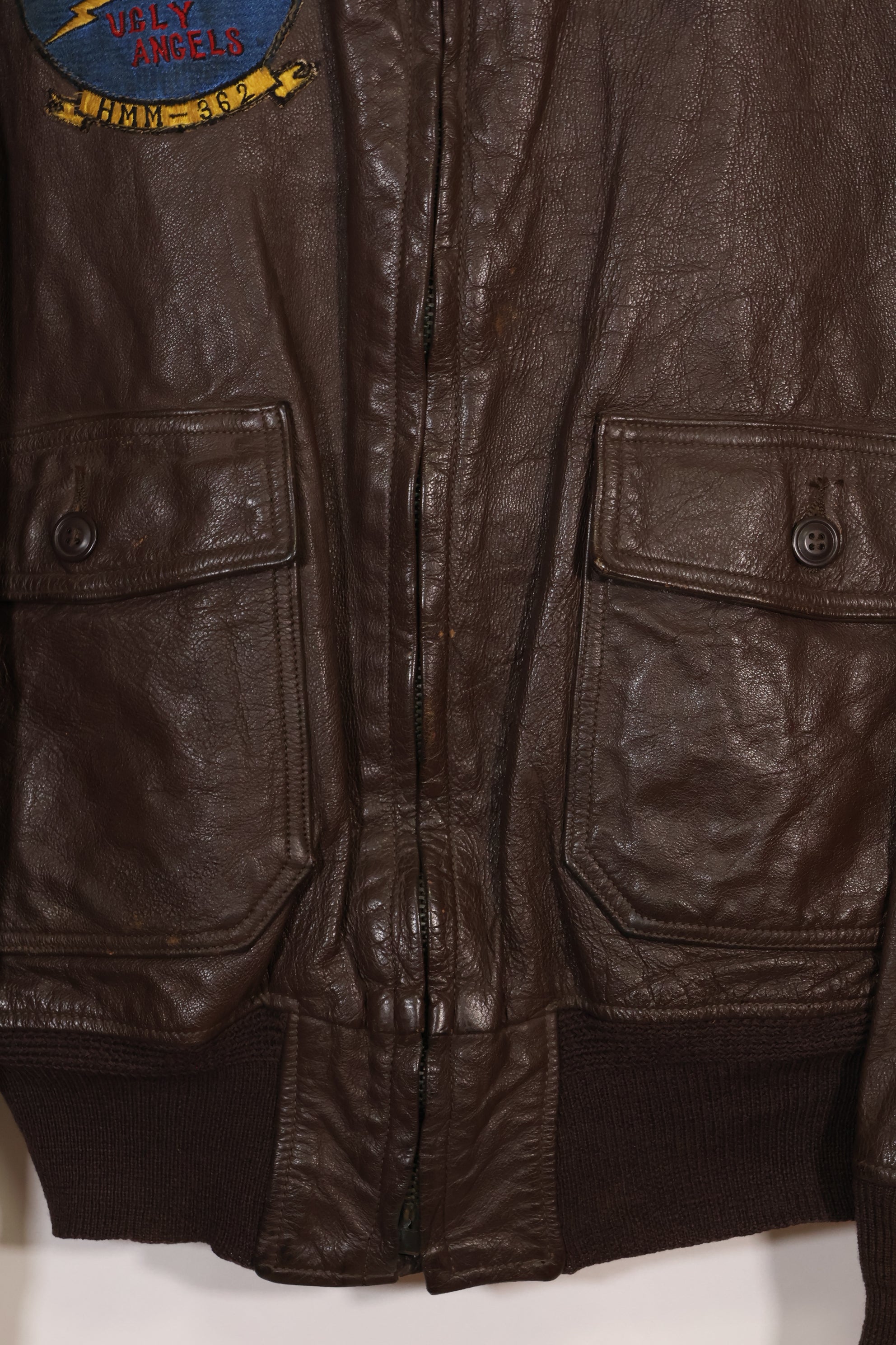 Early 1960s lot size 40 U.S. Marine Corps G-1 UGLY ANGENLS flight jacket, used.
