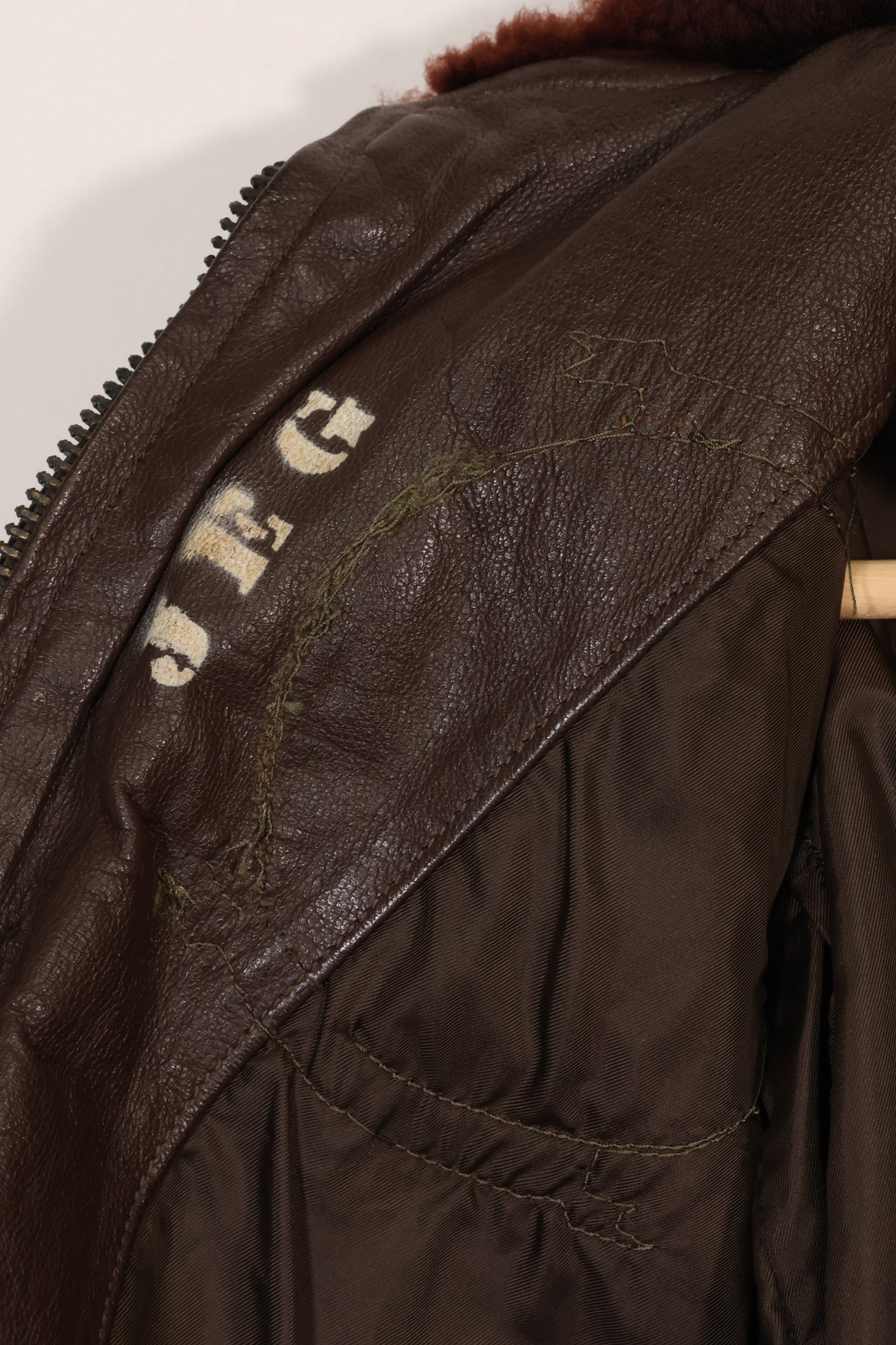Early 1960s lot size 40 U.S. Marine Corps G-1 UGLY ANGENLS flight jacket, used.