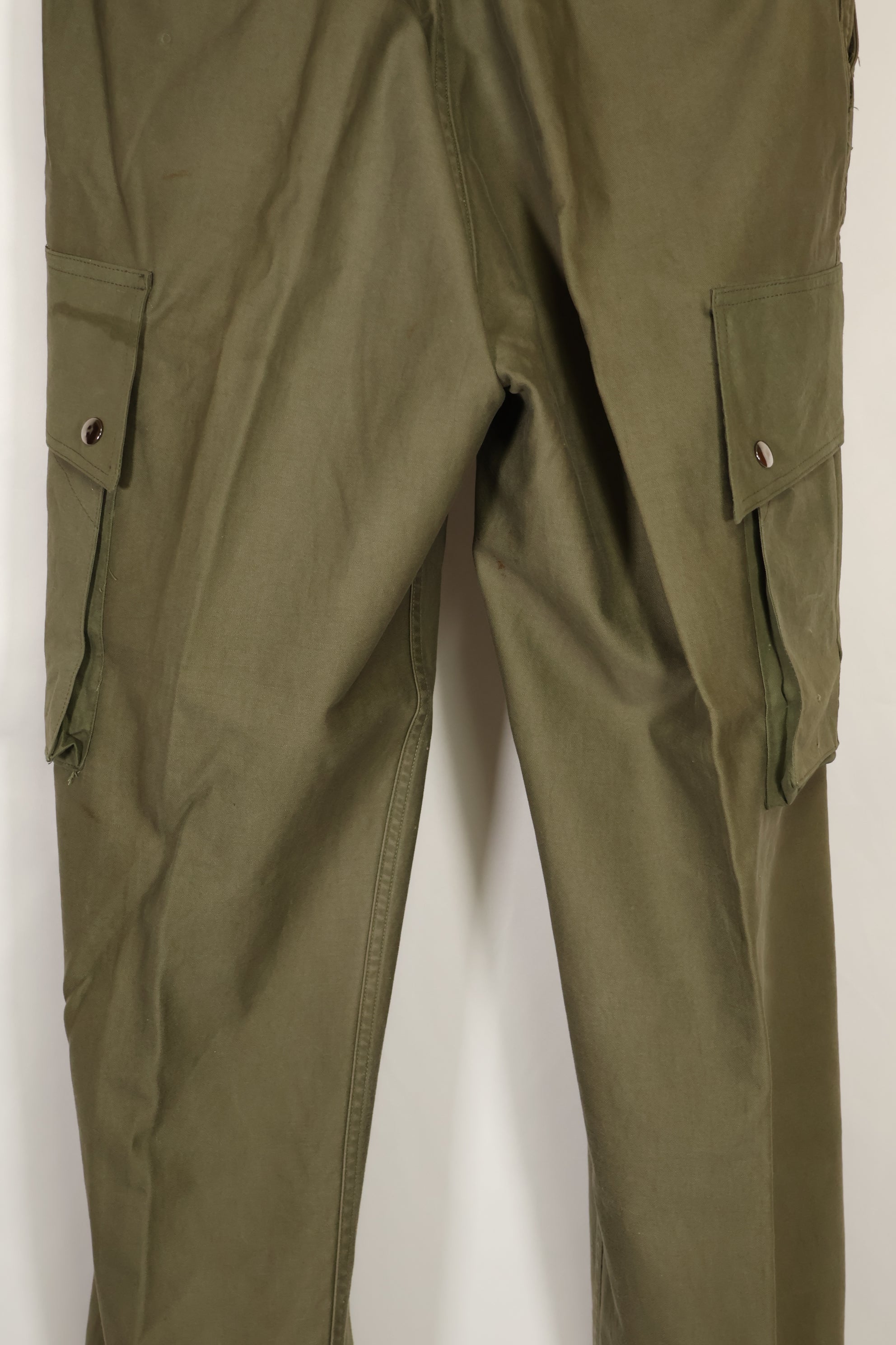 Real U.S. Army M45 pants with additional pocket modification, used.