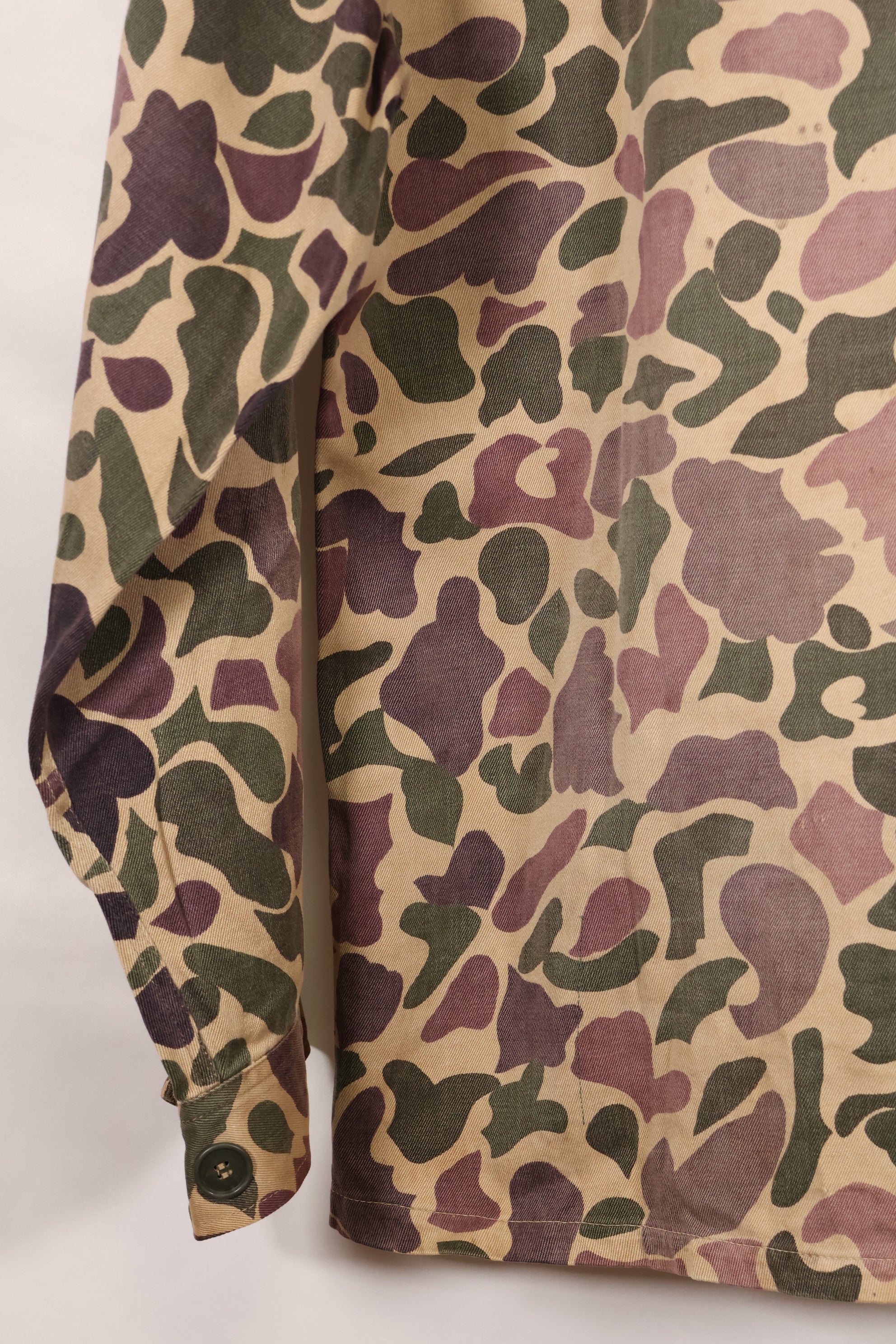 Early 1960s, faded, estimated A-L CIDG, beogum camouflage Asian cut shirt.