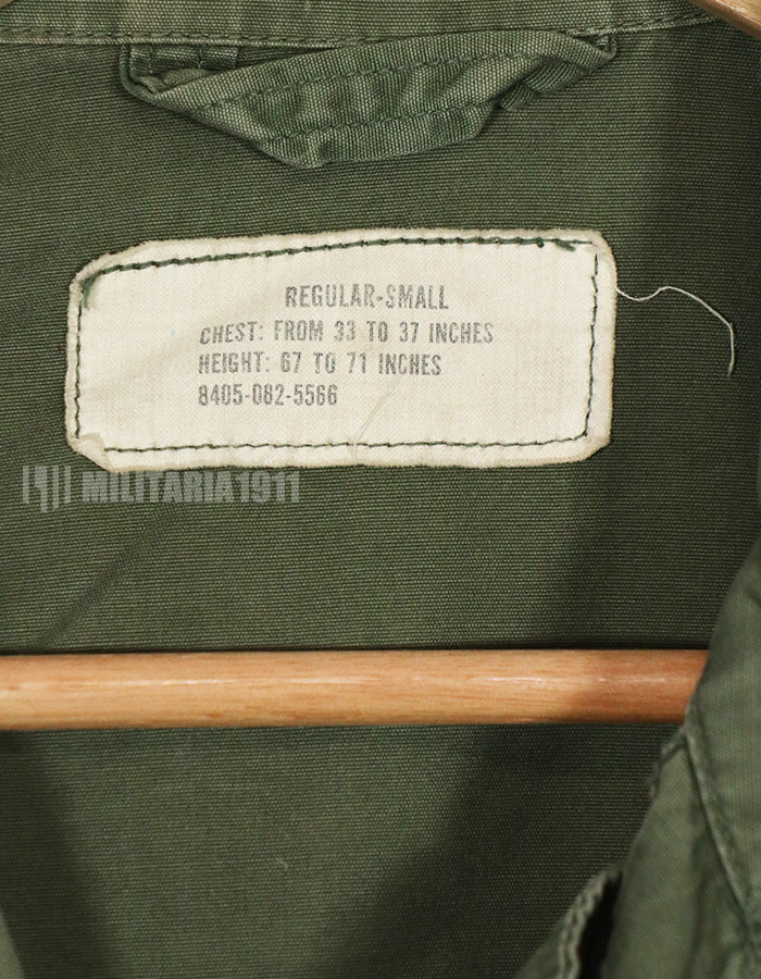 Real 2nd Model Jungle Fatigue Jacket, used, with patches and rank insignia.