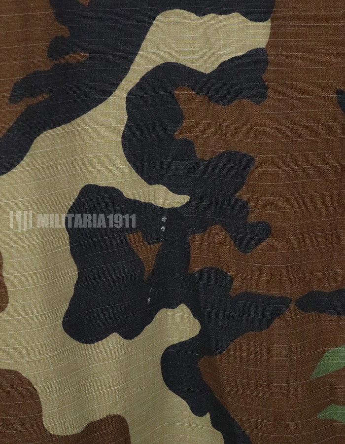 US SURPLUS U.S. Army Special Forces Woodland Camouflage Jacket, 1996, with patches.