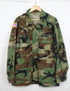 Original U.S. Army Woodland Camouflage Jacket with patches, 1990.